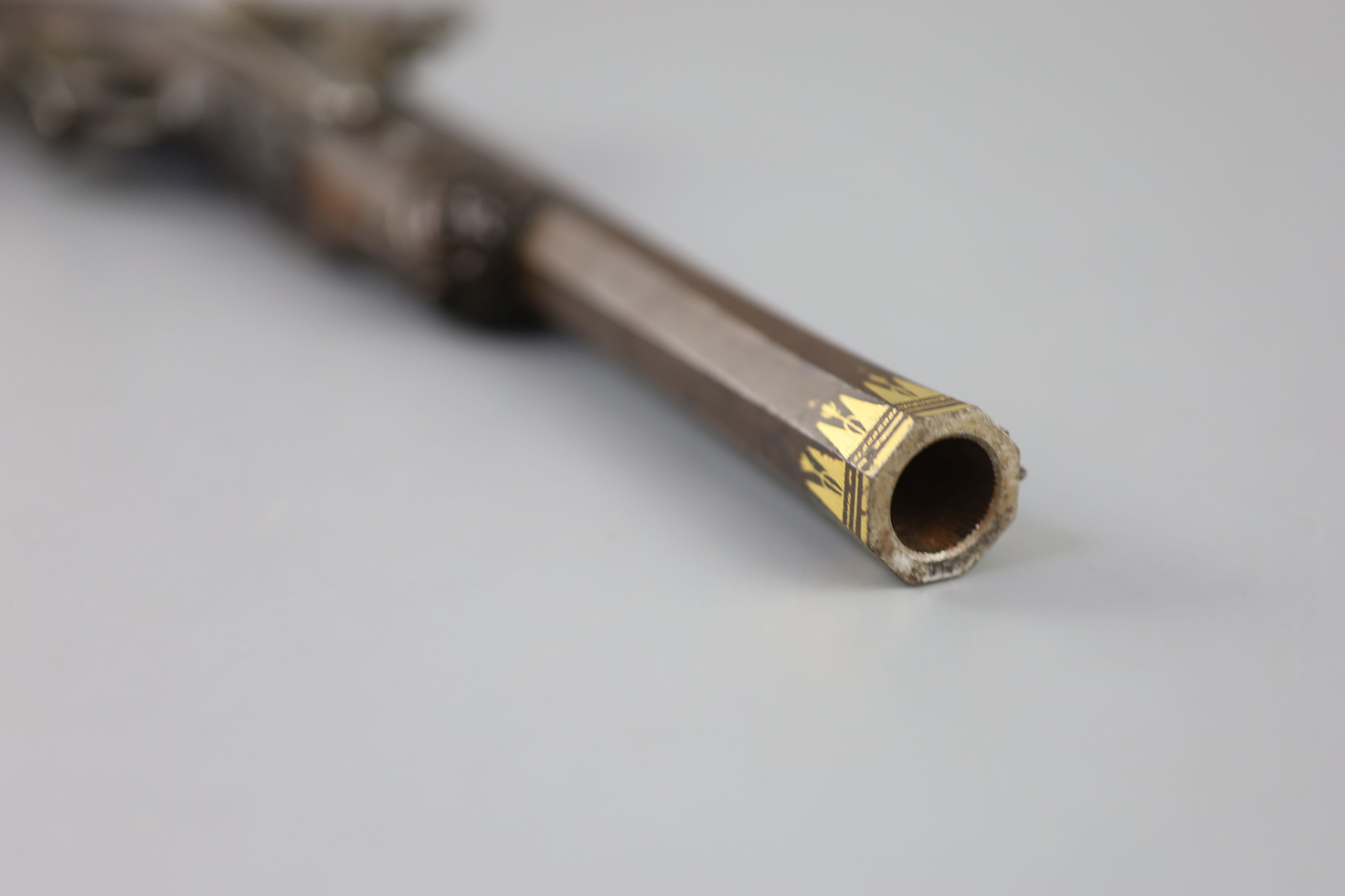 A late 18th/ early 19th century French gold inlaid pistol by Henraux 14.5in.